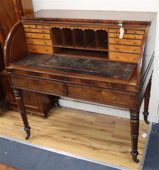 A George IV mahogany coromandel banded cylinder desk W.107cm